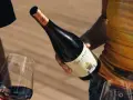 Manos sirven vino tinto de una botella Cap de Pera. Opiniones sobre "llàgrimes de tardor" y la experiencia.