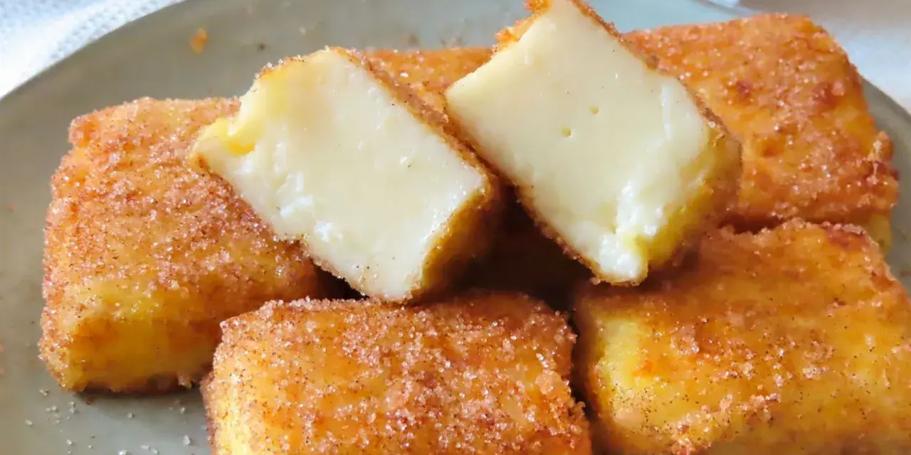 Deliciosa leche frita receta, crujiente por fuera y cremosa por dentro, espolvoreada con azúcar y canela.